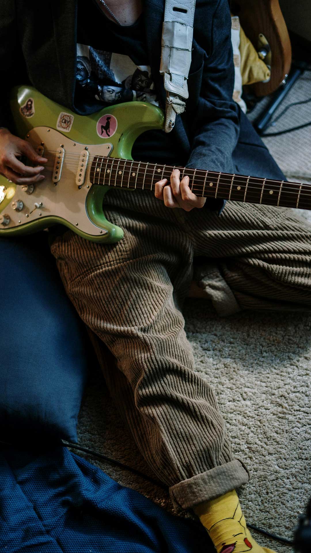 Student relaxing and playing guitar